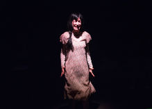 Ivana Wenger performing a solo monologue on stage during an acting school production.