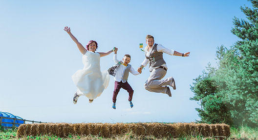 Jumping for Joy after their wedding ceremony. Sawyer and Sawyer Photography