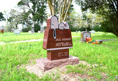 Hopewell is a single individual headstone in the shape of Snoopy on his dog house.