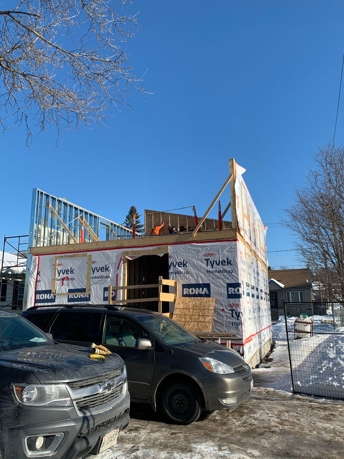 Construction of house, installation of exterior walls and roof 