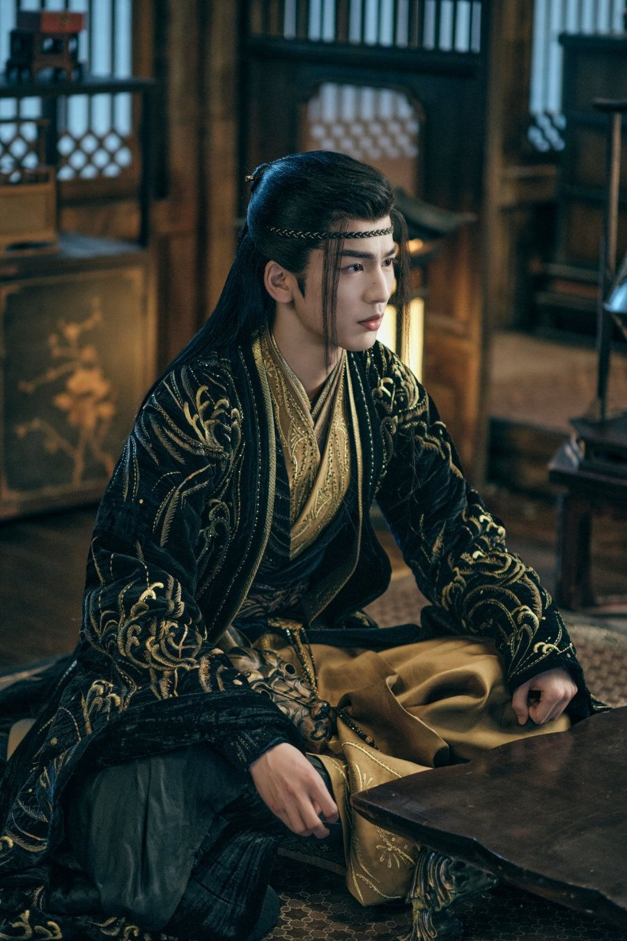Zhang Linghe in My Journey to you in a black and gold outfit with a headband