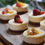 Thumbnail: Premium baked cheesecake with fruit topping and edible gold, ideal for Brisbane catering and events