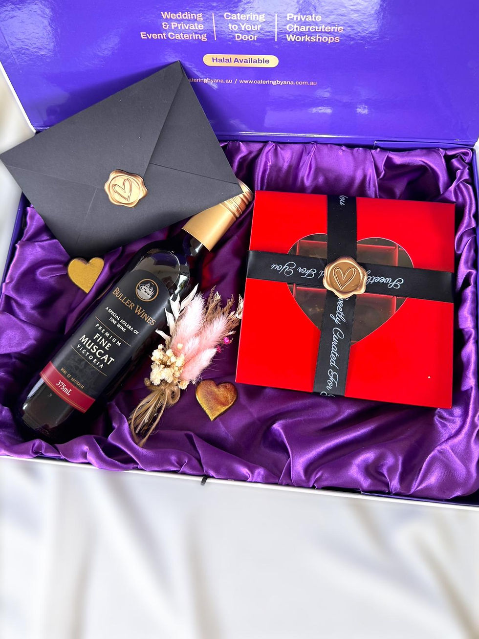 Premium chocolate & wine gift set in Brisbane. Featuring handcrafted chocolate bonbons and dessert wine.