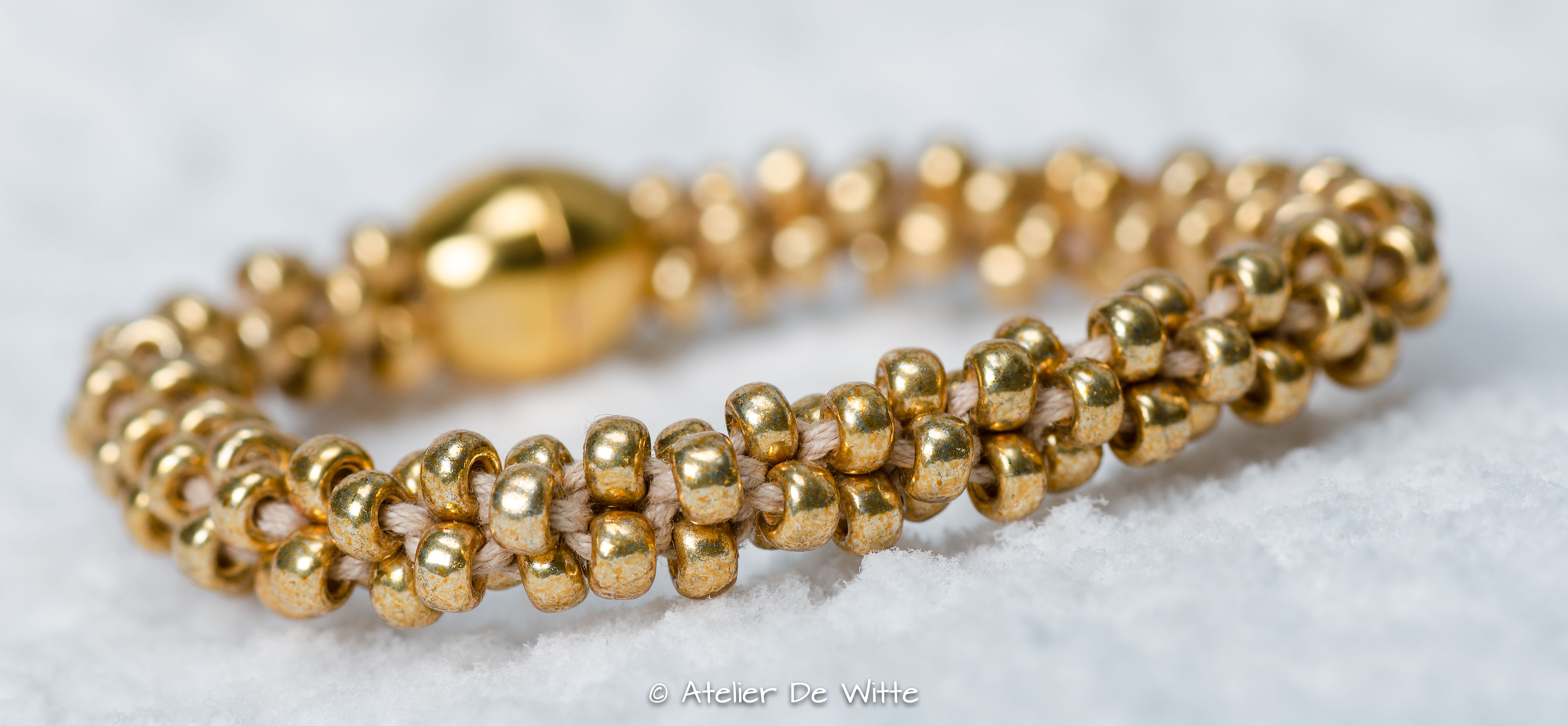 Geknoopte armband goudkleurig