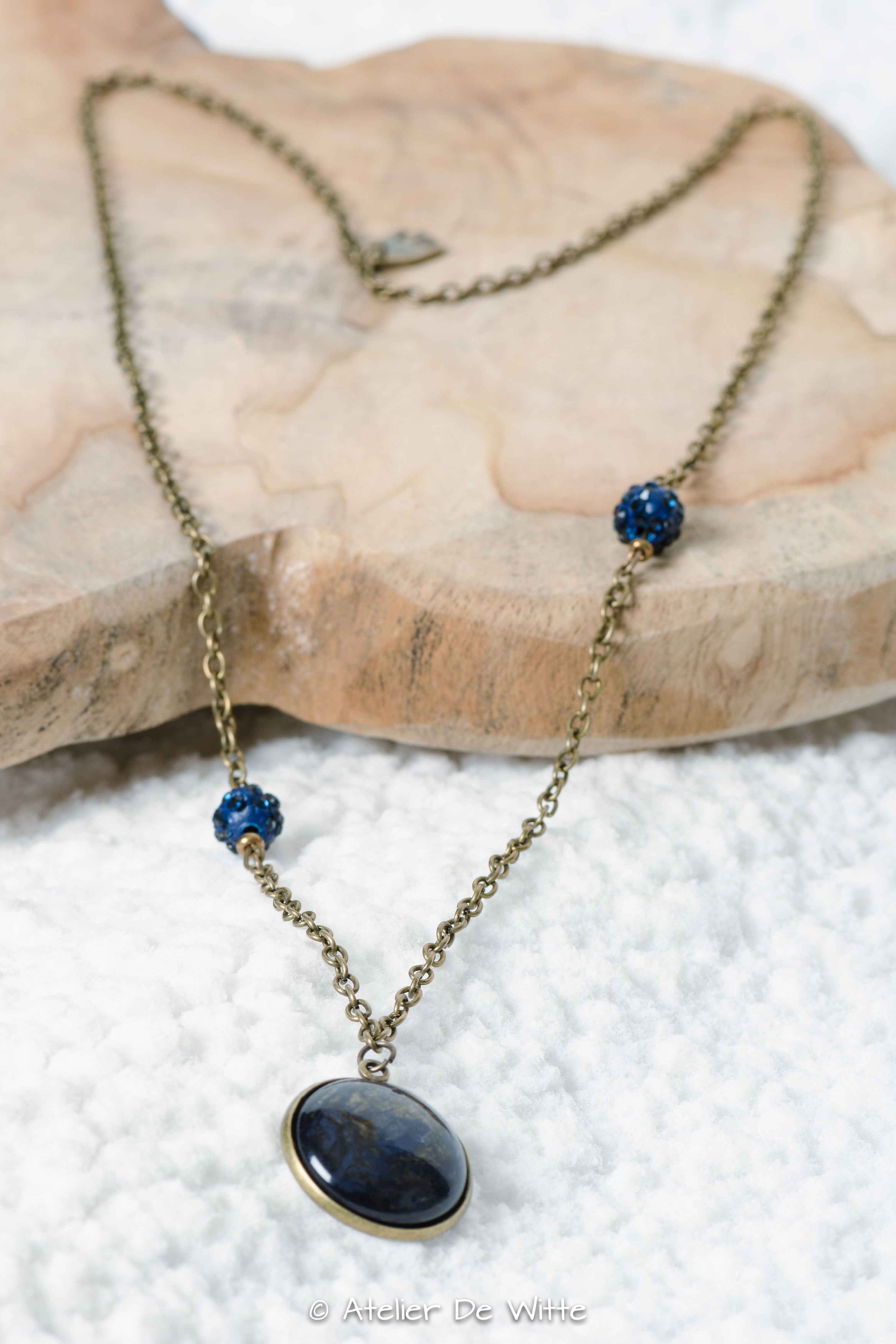 Bronskleurige halsketting met cabochon stardust midnight blue