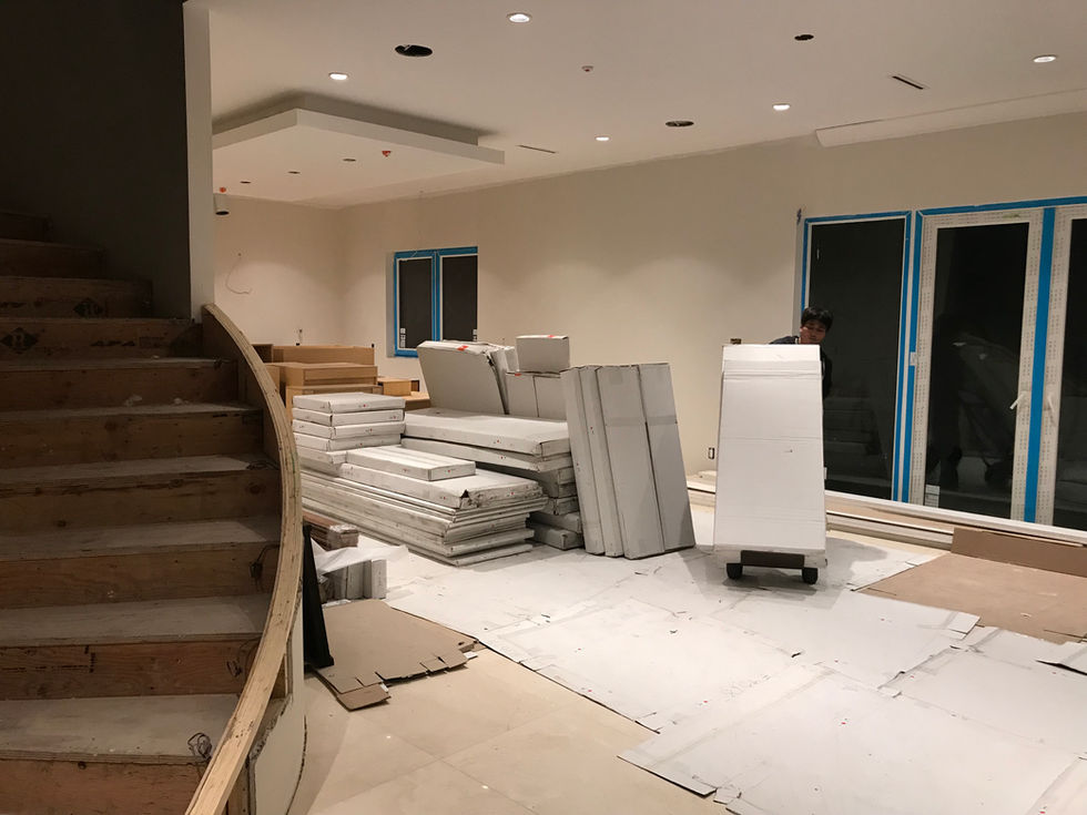 Kitchen cabinetry installation in progress inside a large custom residential project.