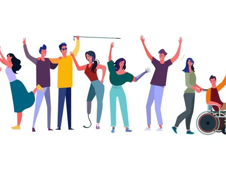 A group of diverse people standing side by side, celebrating together. Two people use wheelchairs, one person has a prosthetic leg, and another holds a white cane. Everyone is smiling, raising their arms, or interacting with one another.