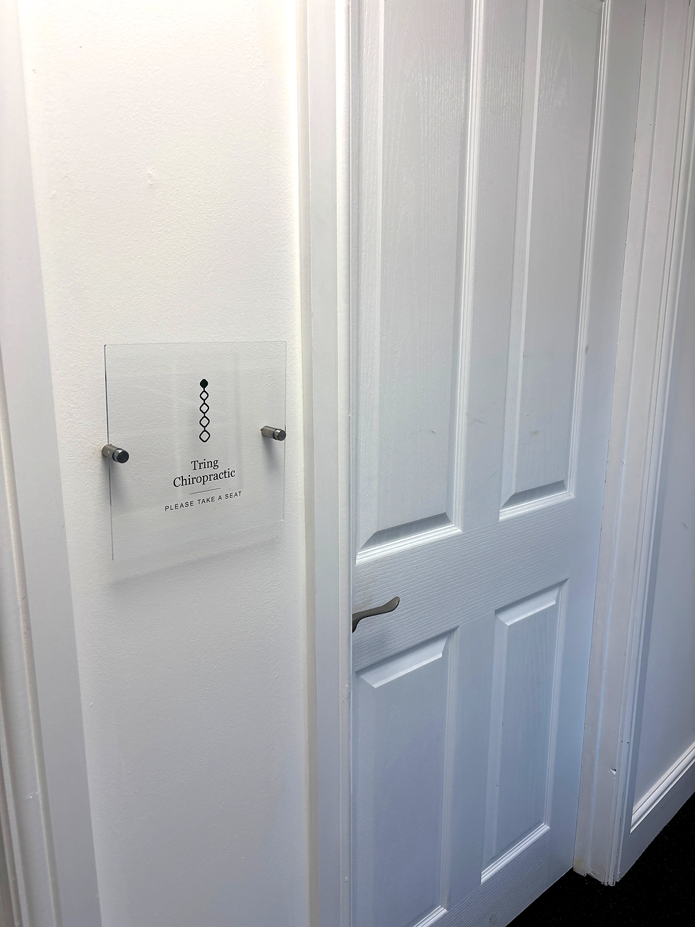 Corridor sign of Tring Chiropractic waiting area in the Silk Mill Business Park