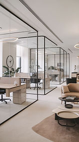 Pristine commercial office space with glass partitions demonstrating professional office cleaning services