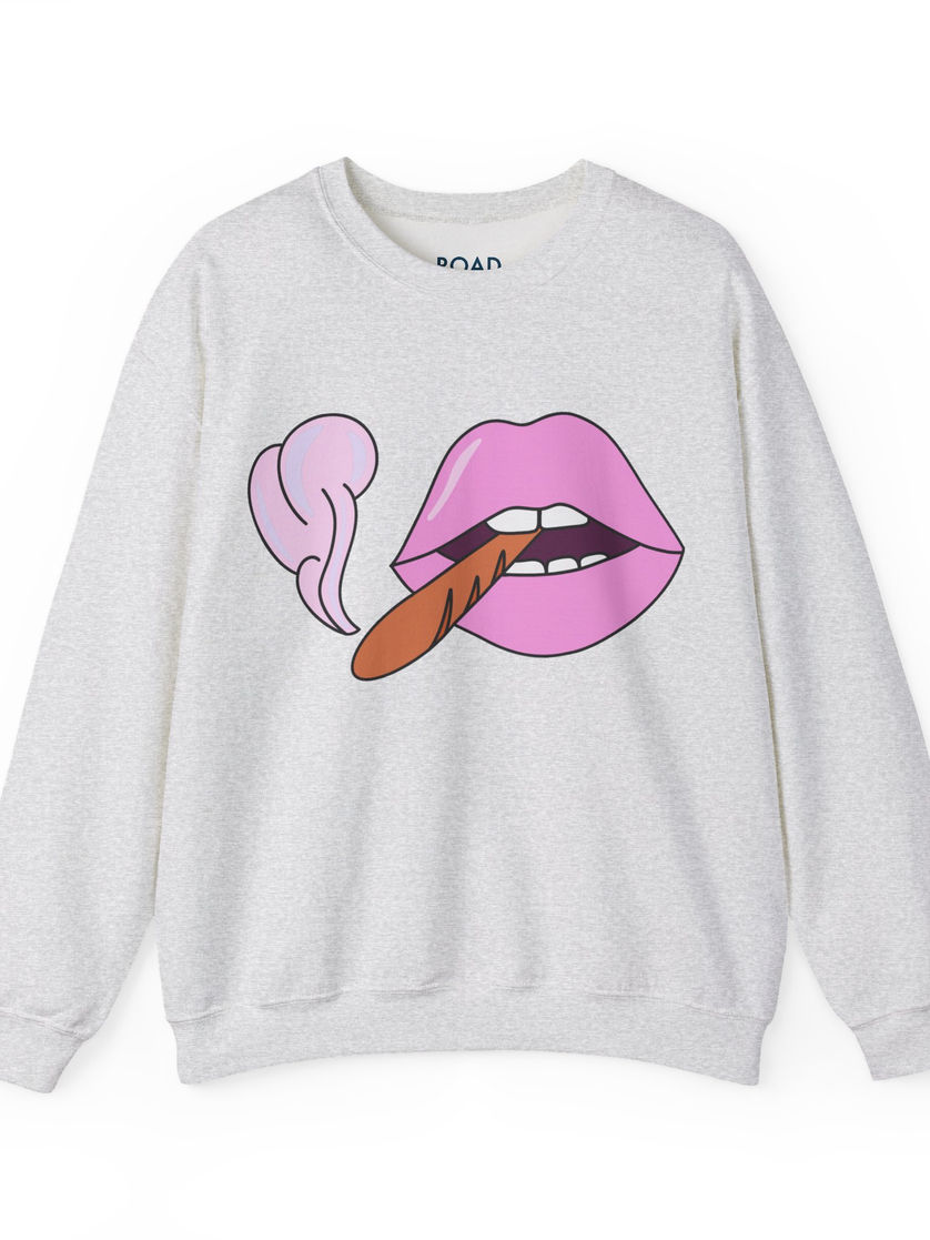 White sweatshirt features cartoon lips with a cigar, for a fashionable look.