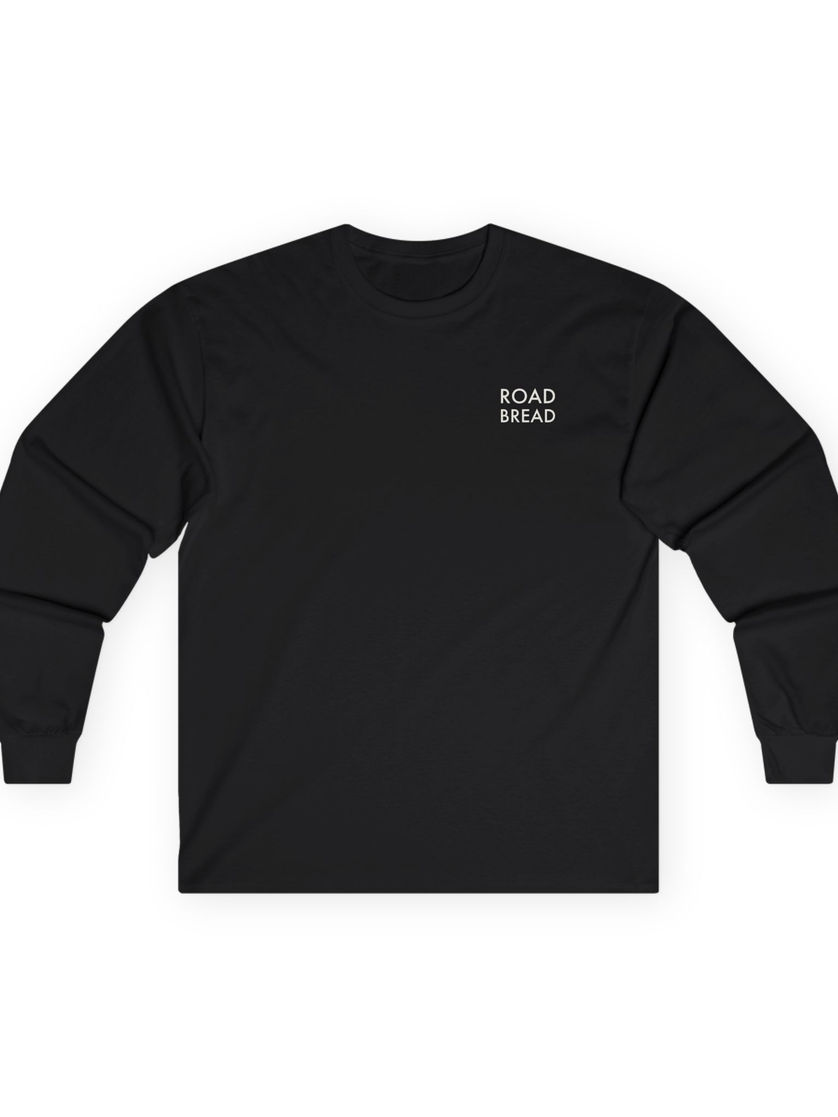 Front of light blue long sleeve shirt with pink Road Bread logo printed on chest