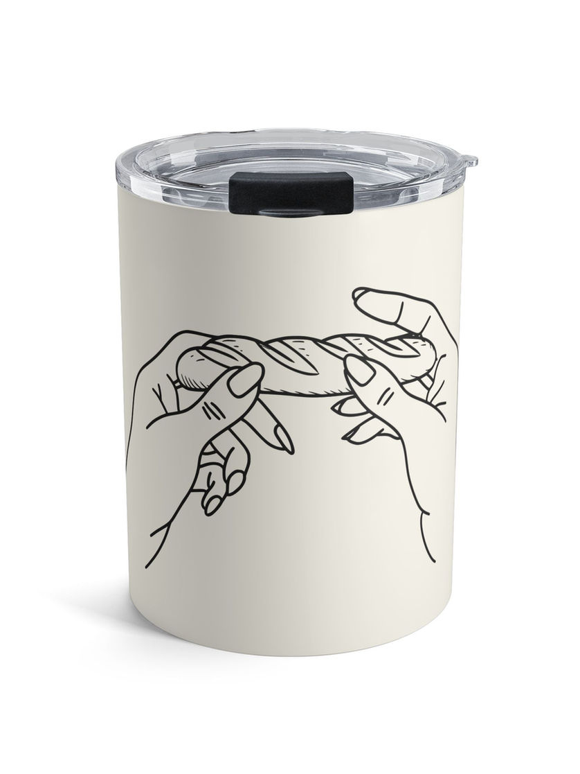 Cream tumbler with hands toasting bread as if it were a drink