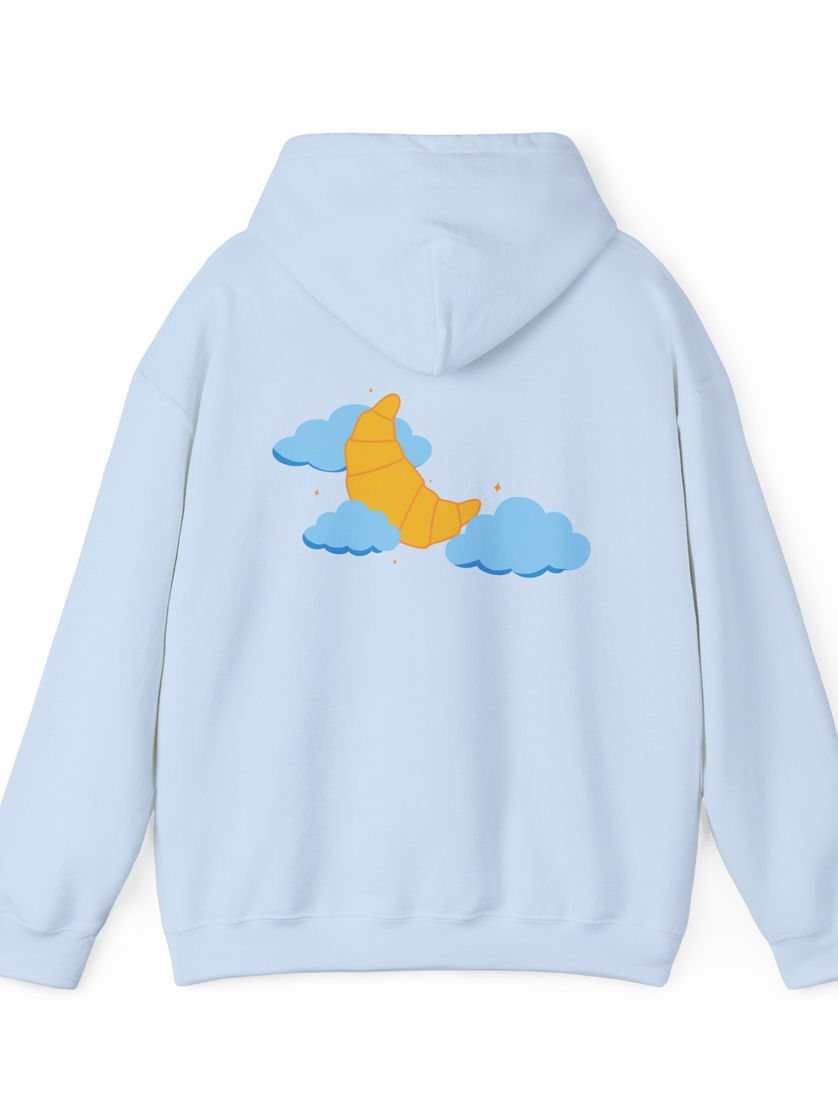 Back of pastel blue hoodie featuring crescent croissant and clouds graphic