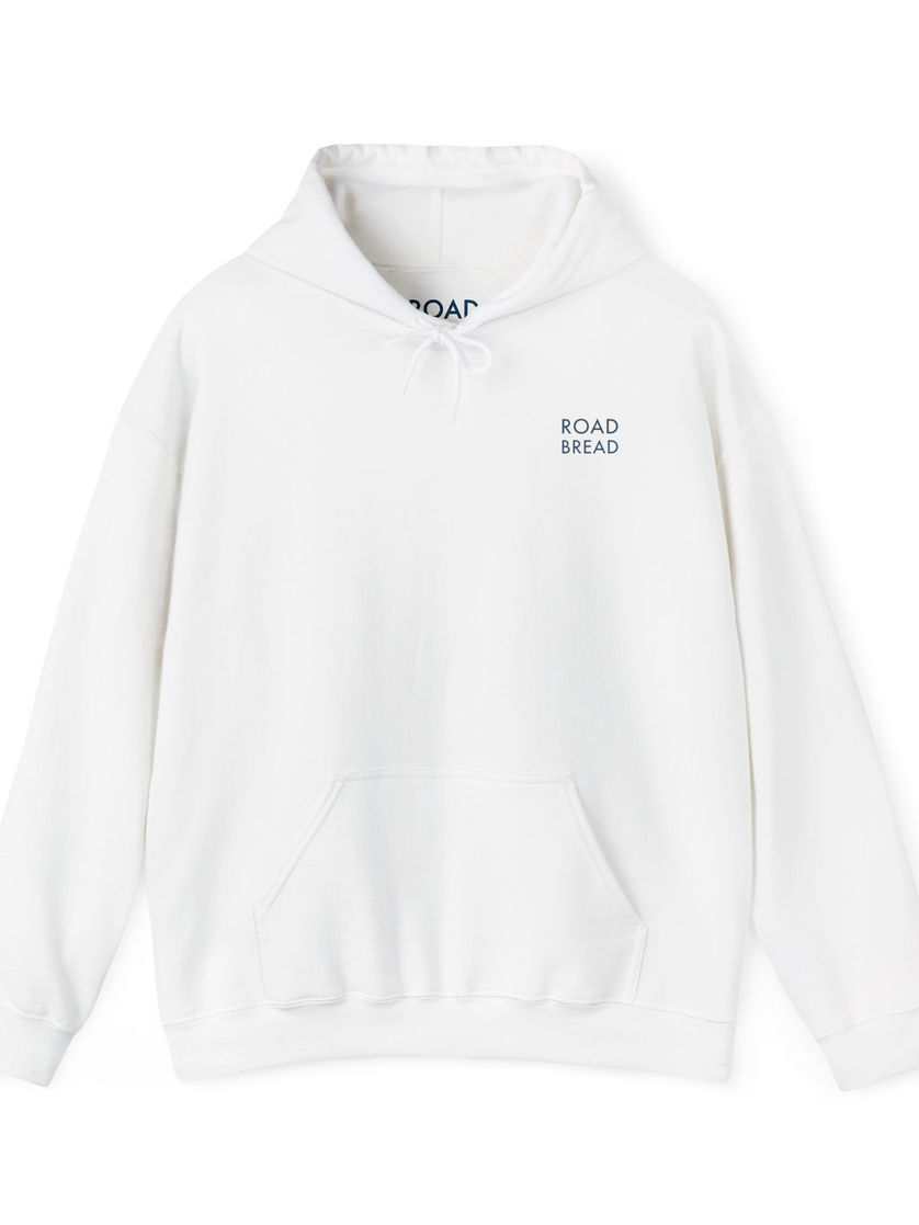 Front of white hoodie featuring small Road Bread logo on the chest
