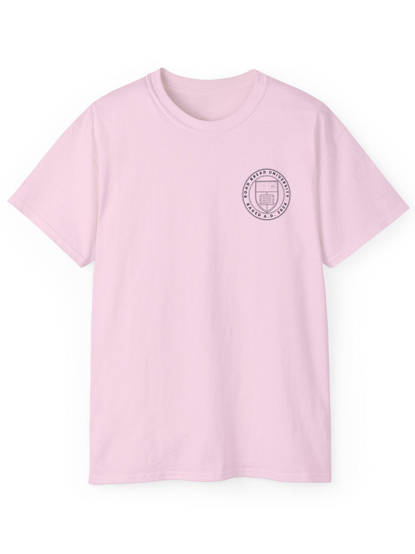 Pink t-shirt with small circular graphic print on front, plain background.