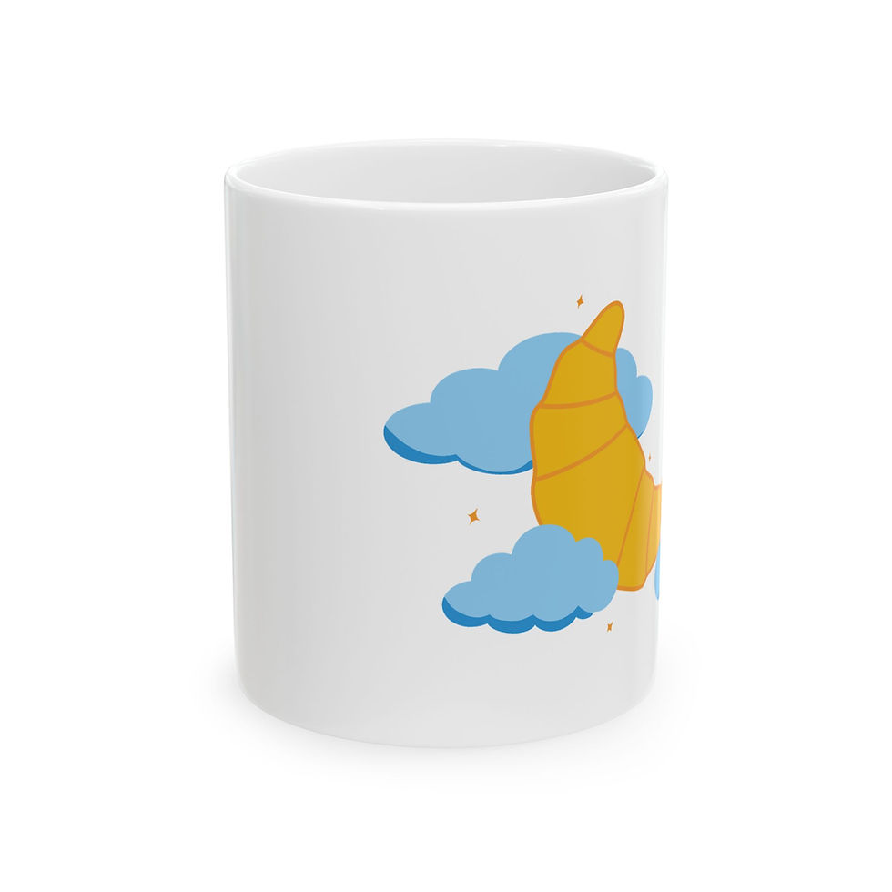 Front of white coffee mug showing Croissant Moon artwork with a crescent-shaped croissant and dreamy cloud details.