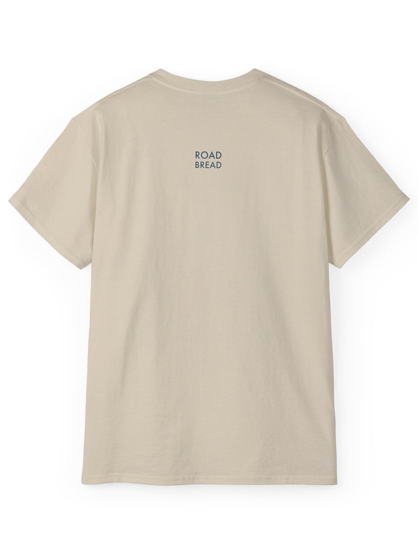 Sand-beige T-shirt, back view, minimalist ROAD BREAD mark at the top center