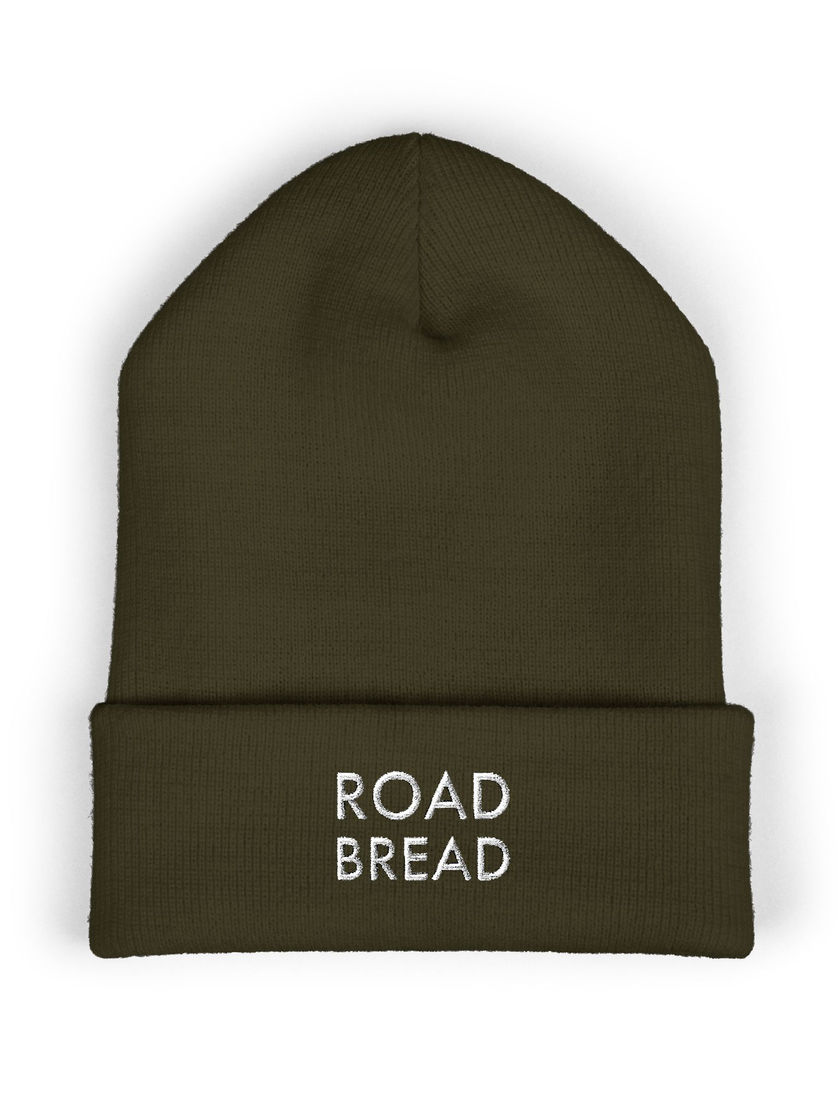 Olive-green beanie, white “ROAD BREAD” embroidery on cuff