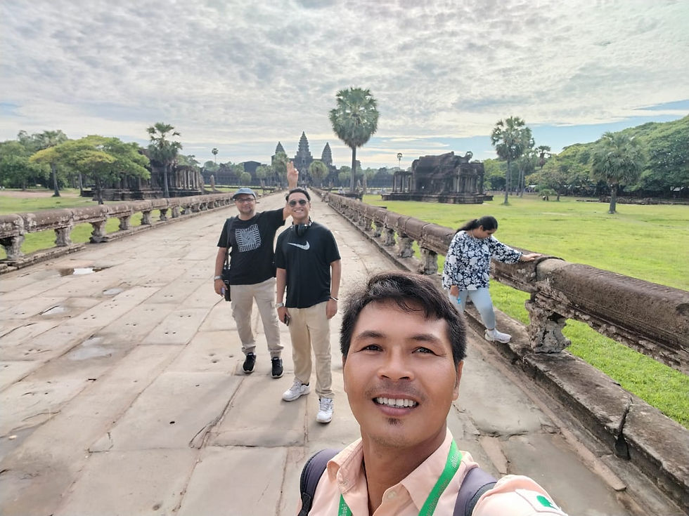 Smiling tourists on Angkor Wat tour