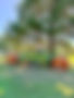 Green farm wagon, OIL RANCH, decorated for fall with pumpkin hay bales.