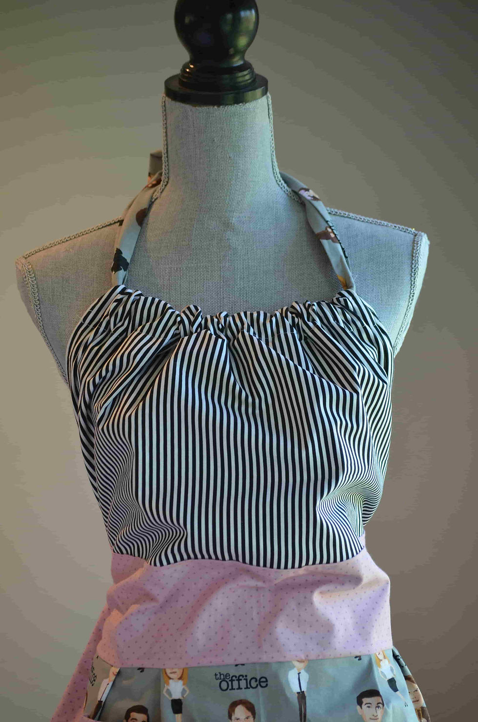 Thumbnail: black & white striped print on top of apron