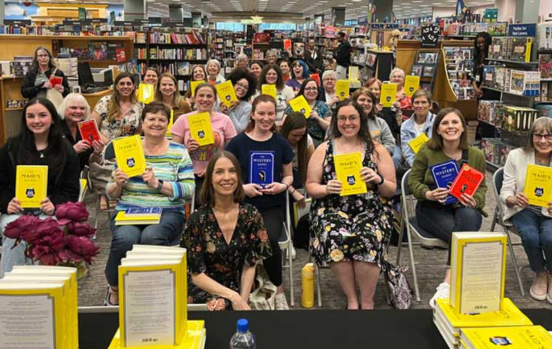 Group their copies of The Maid's Secret at a library event.