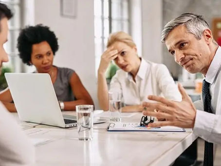 a table of employees of different generations in conflict