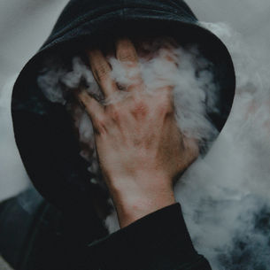 Hooded man with smoking face jaroslav-devia-xfYiIpHnvhs-unsplash.jpg