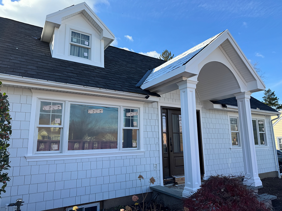 Eye-level view of a house exterior showing different siding materials