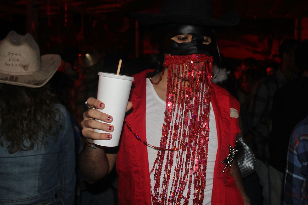 Bernie Manzolillo enjoyed a refreshing soda while dancing in his Orville Peck inspired outfit.