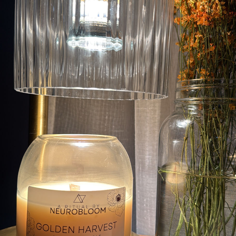 Warmly glowing 8oz natural soy wax Golden Harvest Candle, perfect for seasonal ambiance.