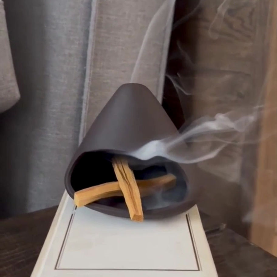 Palo Santo sticks arranged with minimalist ceramic burner and intention card, perfect for home rituals and spiritual alignmen