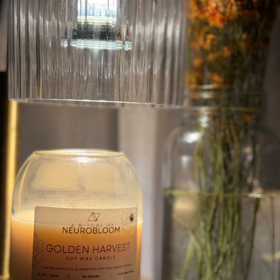 Close-up of Golden Harvest Candle lit, creating a cozy and warm atmosphere.