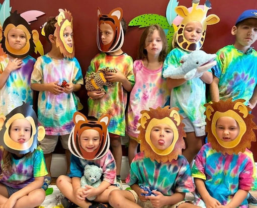 Children wearing handmade animal masks at a crafts class during Limpopo School summer camp in Ontario