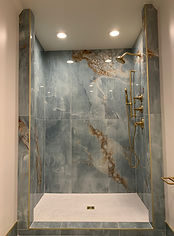 Tile art in a custom hall bathroom remodel
