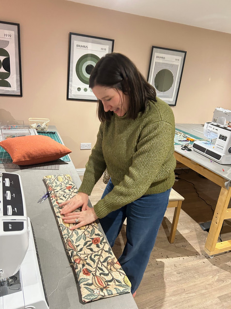 Student in our beginner's sewing class making a lovely draught excluder in WIlliam Morris fabric