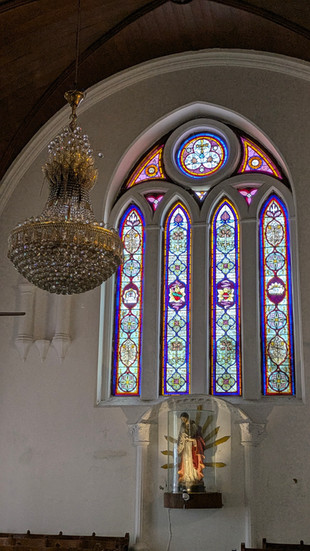 Stained glass inside San Thome Basilica, chandelier, church interior