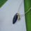 Thumbnail: Obsidian surf pendant with gold moon charm