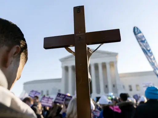 An anti-abortion protester stands in front of the Supreme Court as it listens to arguments in the case seeking to overturn Roe v Wade in December. Photograph: José Luis Magaña/AP