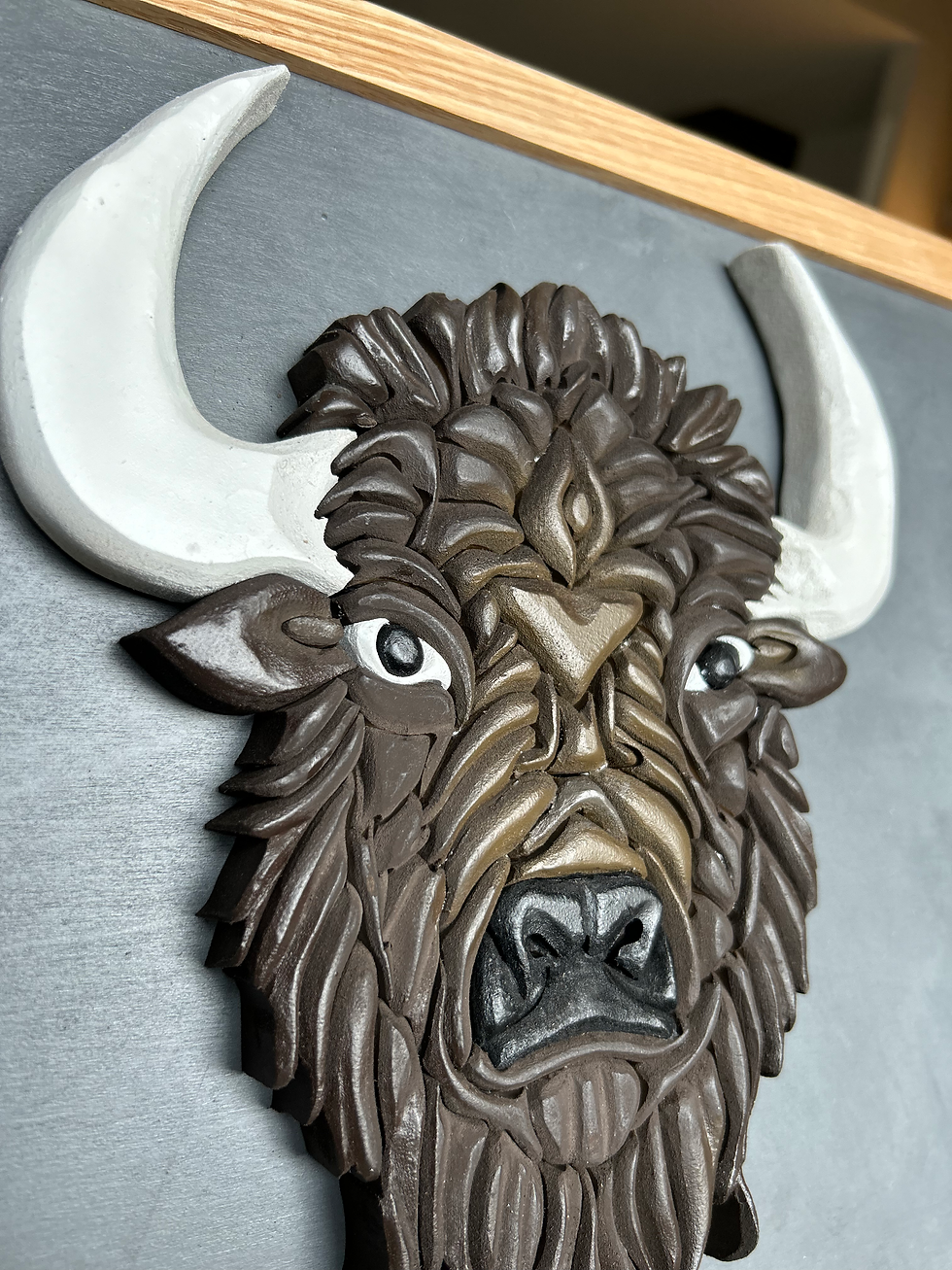 Thumbnail: Scroll Saw cut and hand painted brown wood buffalo art with an oak frame