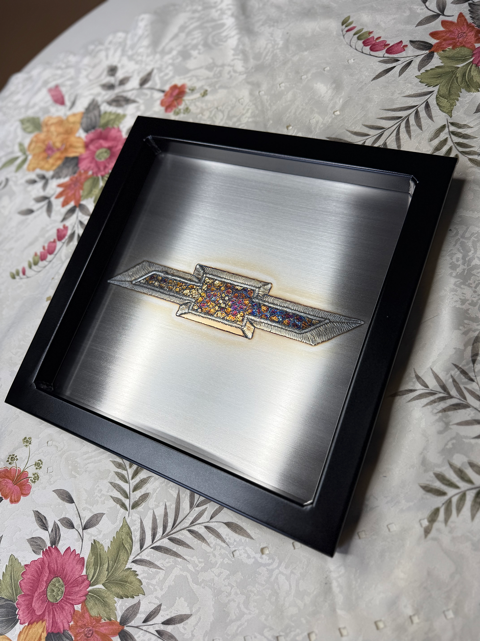 Thumbnail: contrasting pretty colors of the Chevy logo in weld art Chevrolet right side view