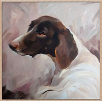 Photograph of a pet portrait in a pale natural hardwood frame