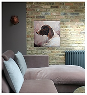 Photograph of a large size pet painting scaled to a seater sofa