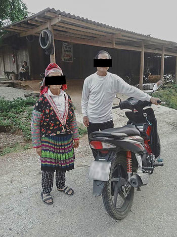 Tahang, shown with his wife, travels thousands of miles a year on his motorbike to serve churches in his region