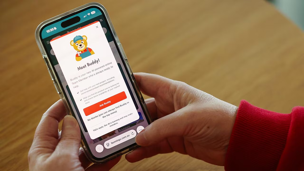 Hands holding a smartphone showing a Bunnings app popup for Buddy, an AI helper, over a wooden table.