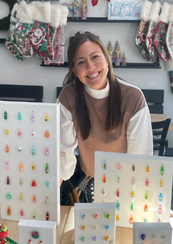 artist posing next to text