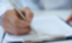 person filling out insurance paperwork