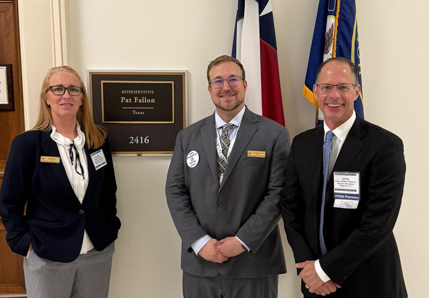 Brandi Chane, Chris Hobart, and Steve Hoffart with Pat Fallon's plaque