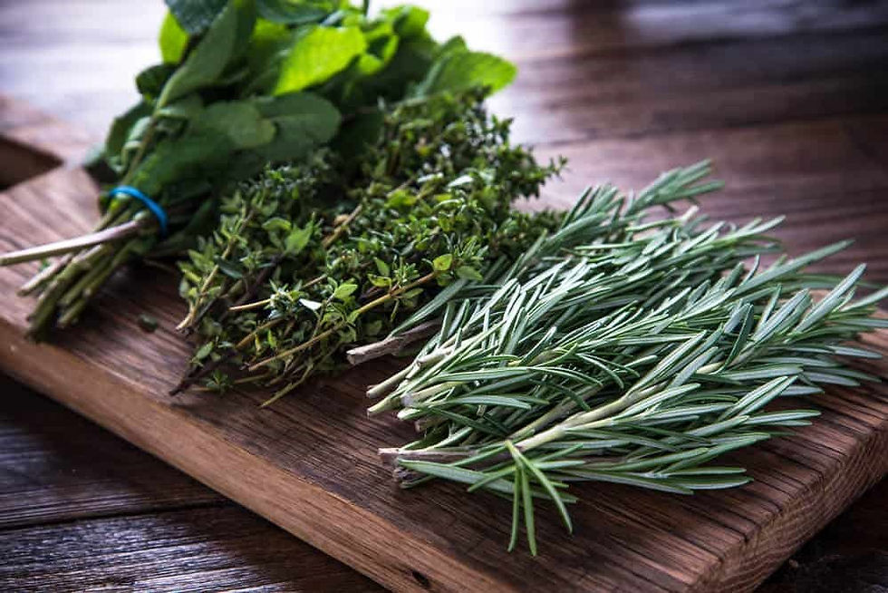 bunches of herbs on cutting board