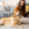 woman and dog sitting on floor